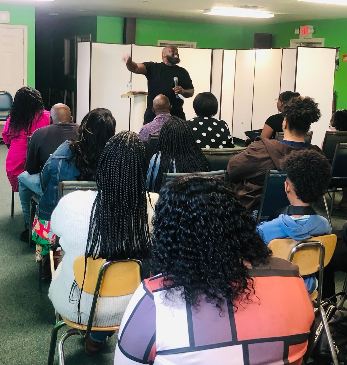 Reno Flournoy teaching a group during a community gathering