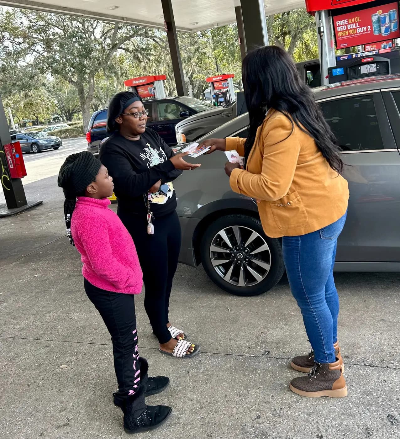 A gas card being provided during community outreach