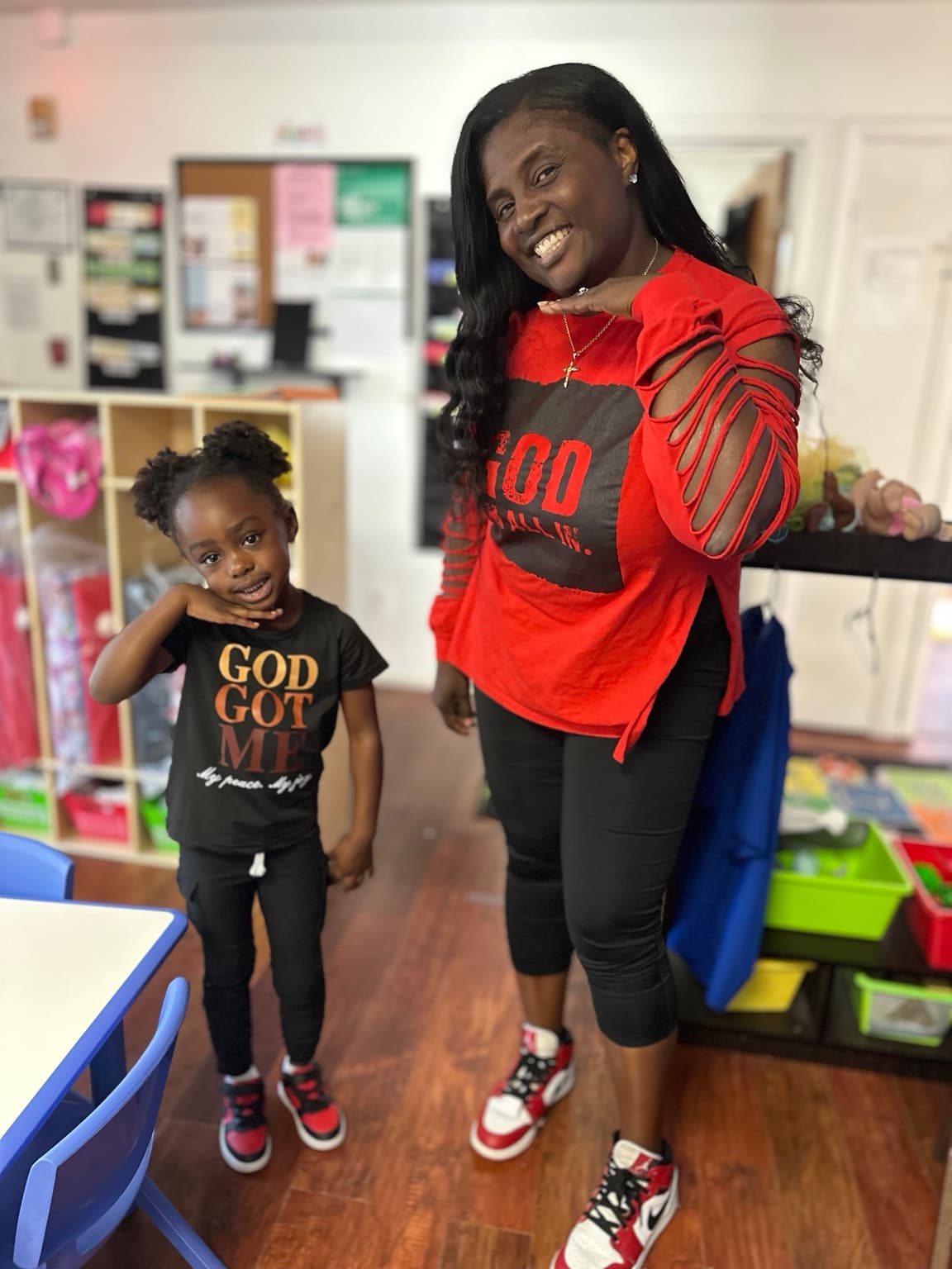 A Stepping Stone leader supporting a child during a classroom activity