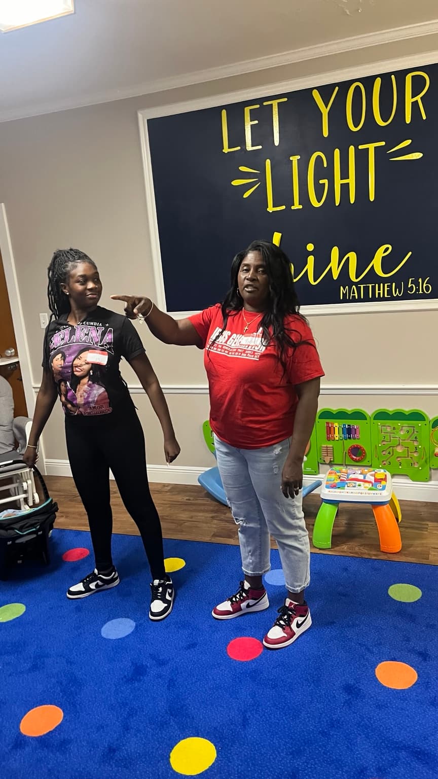 A mentor leading a learning activity with a young person
